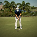 Image of a focus face of a golfer entering Blackout Mode representing a quiet mind, committing to the target, and pulling the trigger.